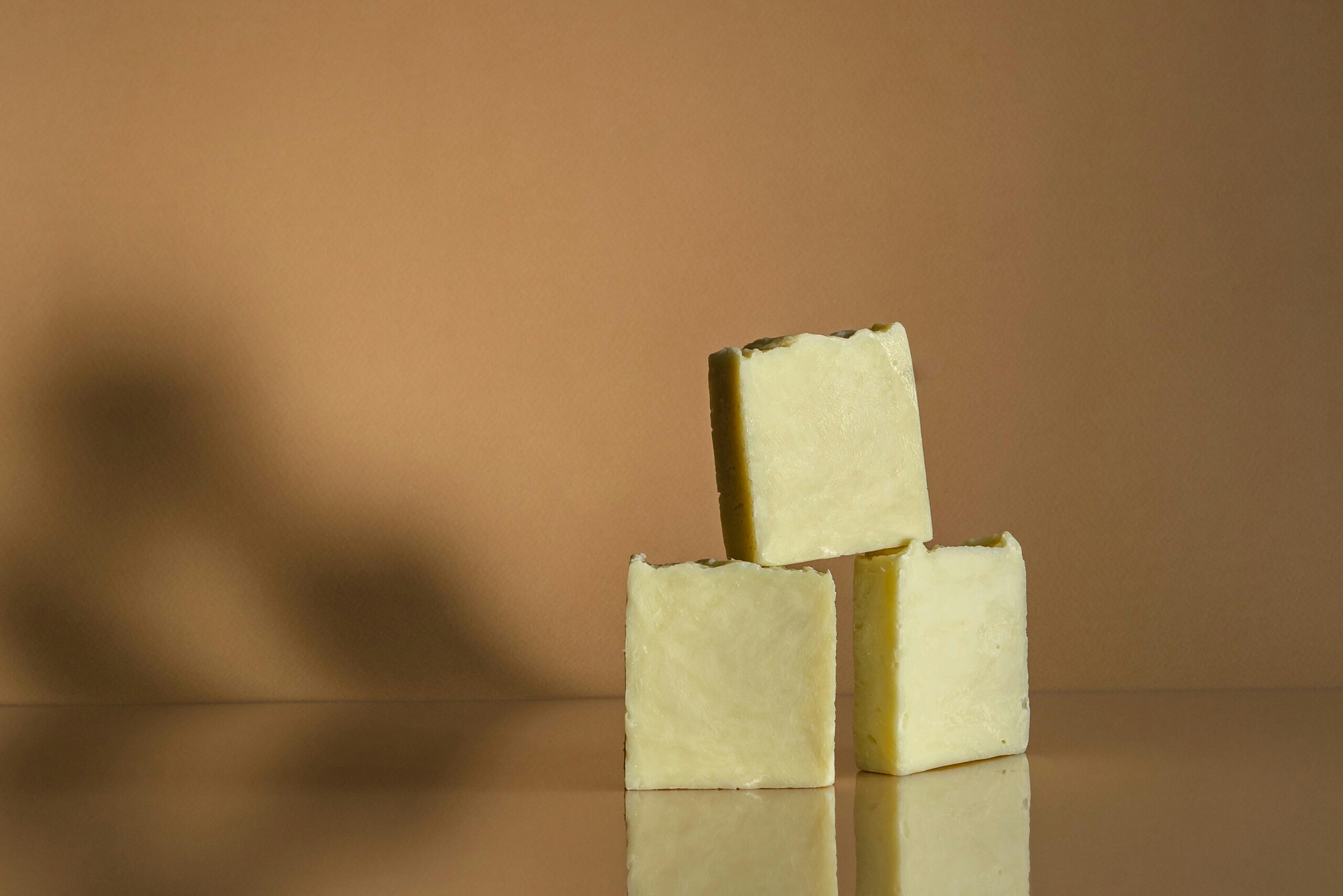 Photo by Mikhail Nilov: https://www.pexels.com/photo/close-up-photograph-of-a-stack-of-soap-bars-7814808/